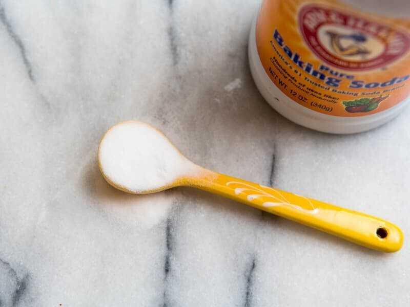 Sprinkle baking soda on the leather surface in your car to deodorize