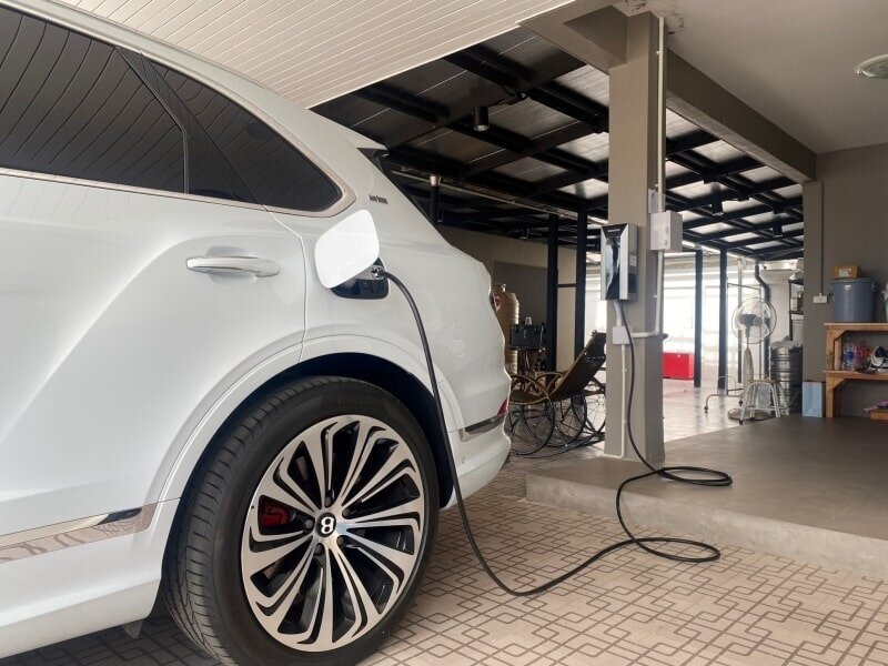 When charging an electric car at home, choosing between a 120V and 240V outlet affects charging time and cost.